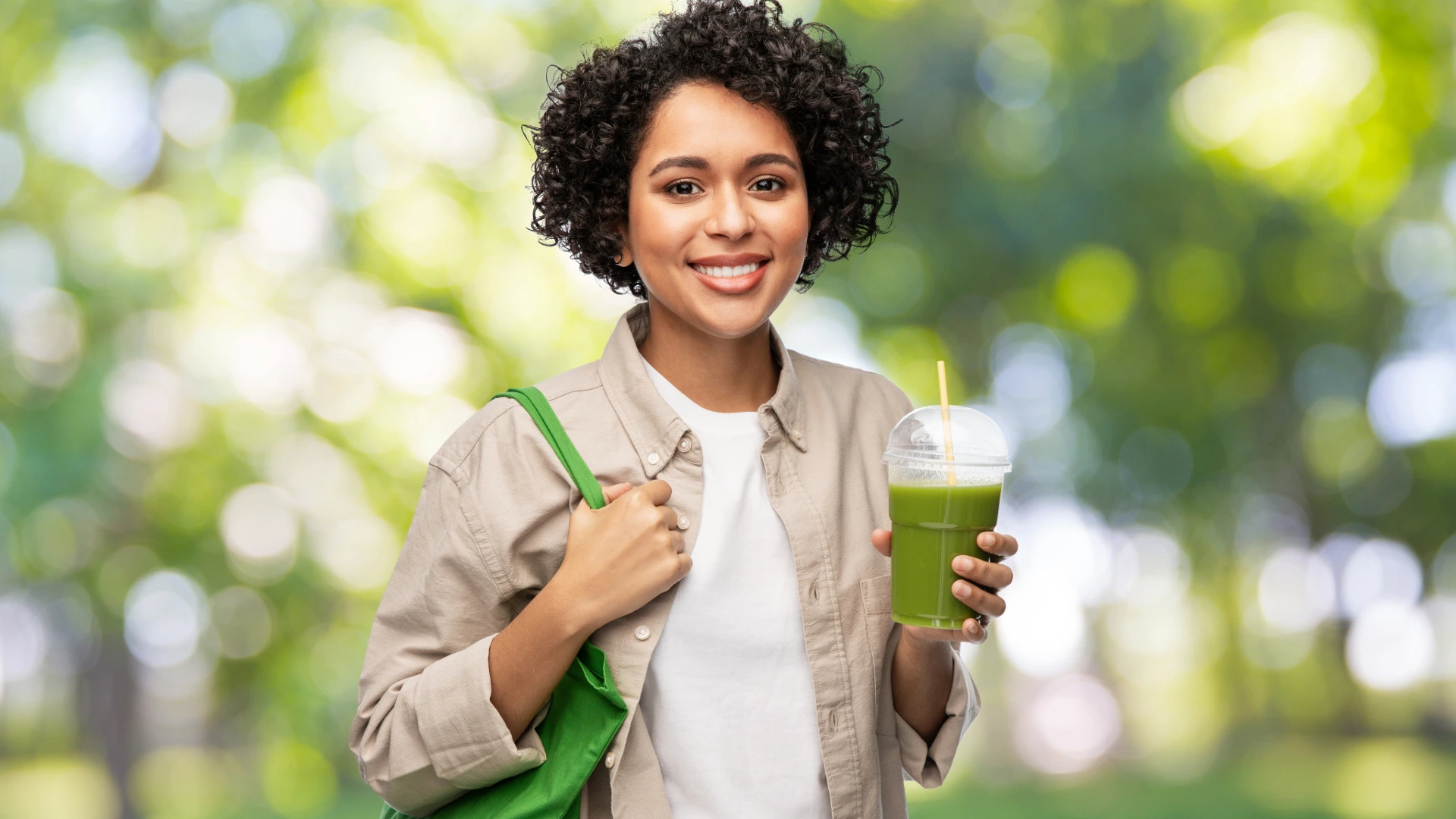 woman drinking a smoothie - detox and mindful eating